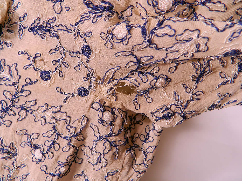 Vintage White Cotton Lace Blue Embroidered Stitching Belted Swing Day Dress. It is in good condition, with only a small faint age spot stain on the skirt and a small frayed hole under the arm and on the sleeve (see close-ups). This is truly a wonderful piece of  wearable art.