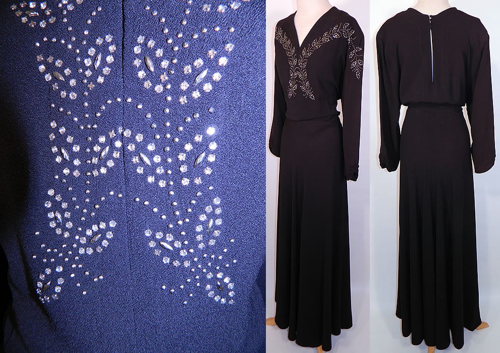 Vintage Black Silk Crepe Silver Studded Rhinestone Beaded Evening Gown Dress. This elegant evening gown floor length dress has a V front neckline, a key hole opening back with button closures on the neck, long full sleeves, a long full skirt and side zipper closure...