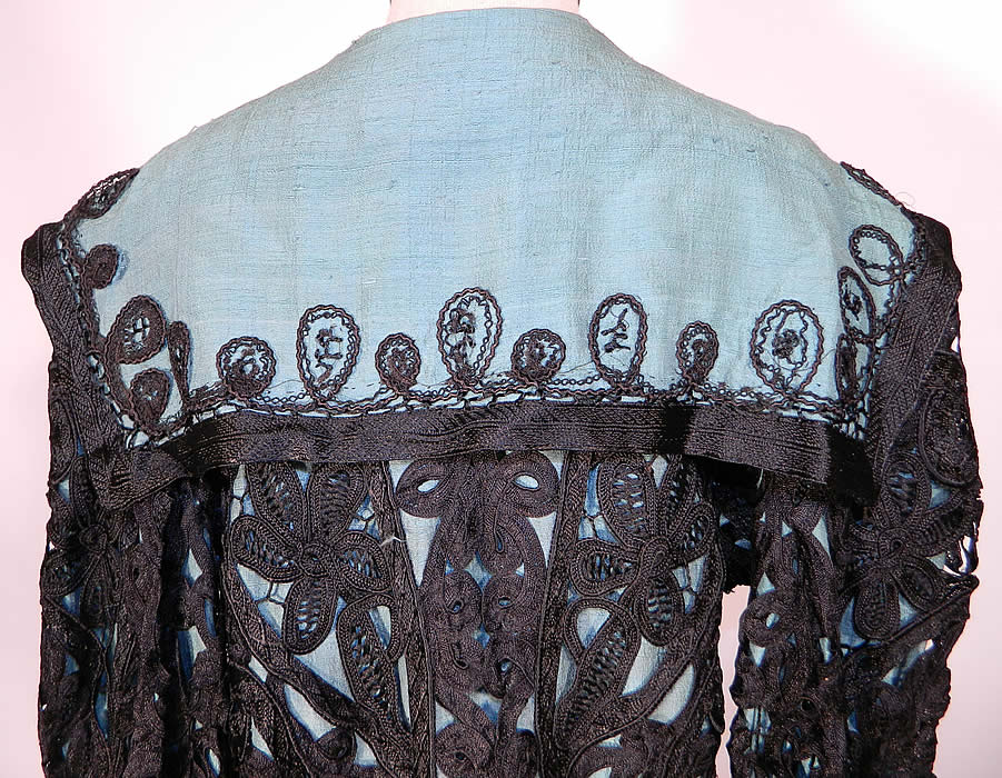Edwardian Turquoise Blue & Black Silk Battenburg Tape Lace Coat Jacket. The coat measures 35 inches long, with 42 inch hips, a 38 inch waist,  40 inch bust, 14 inch back and 20 inch long sleeves. 
