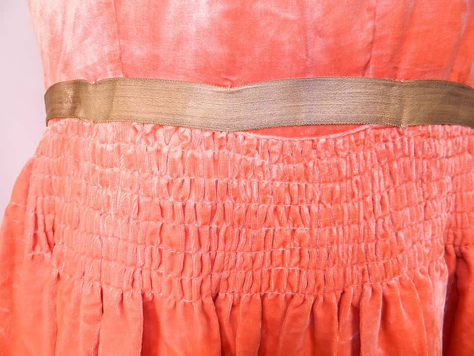 Vintage Coral Velvet Pastel Rosette Gold Lam&eacute; Ribbon Belted Drop Waist Flapper Dress. This fabulous flapper dress has a loose fitting drop waist style, is sleeveless, with side snap closures. The dress measures 41 inches long, with 36 inch hips, a 28 inch waist and 34 inch bust. It is in good condition. This is truly a gorgeous quality made piece of Art Deco wearable art! 