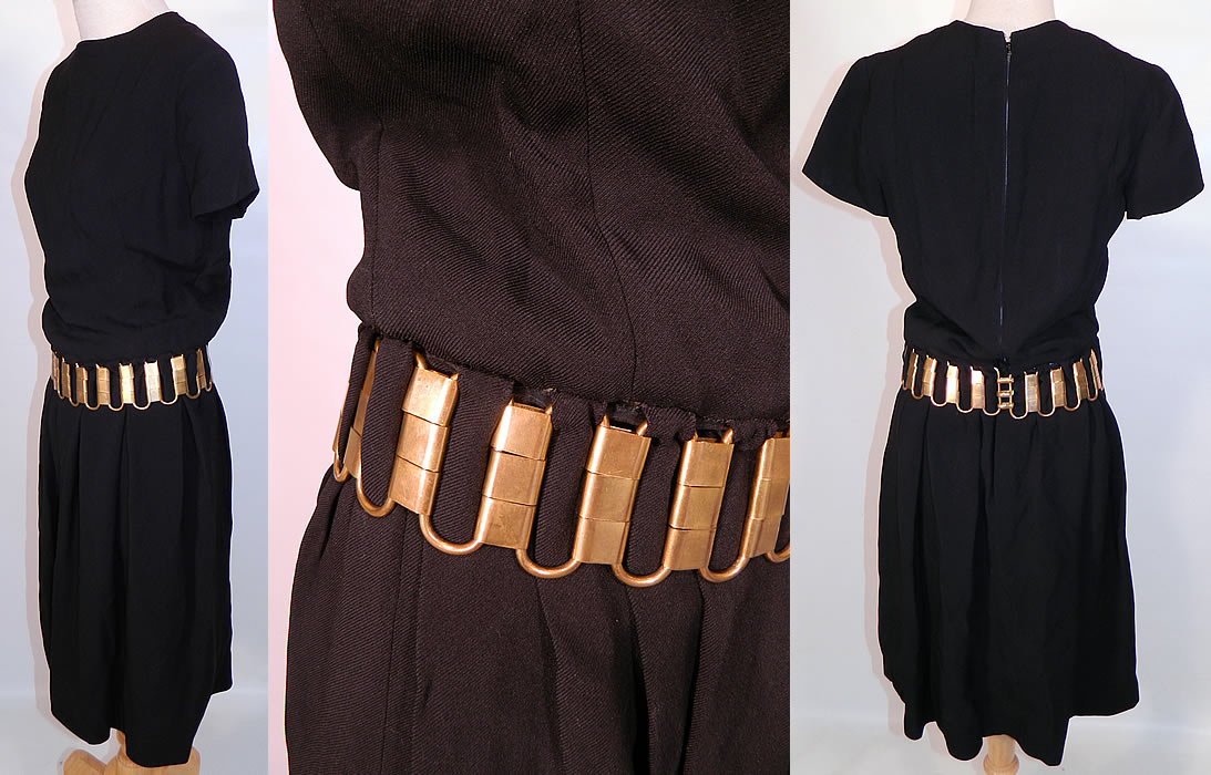 Vintage Christian Dior Paris Gold Chain Link Belted Black Cocktail Dress. It is made of a black acetate fabric, with a heavy gold brass chunky chain link belt hand sewn and woven around the waist.