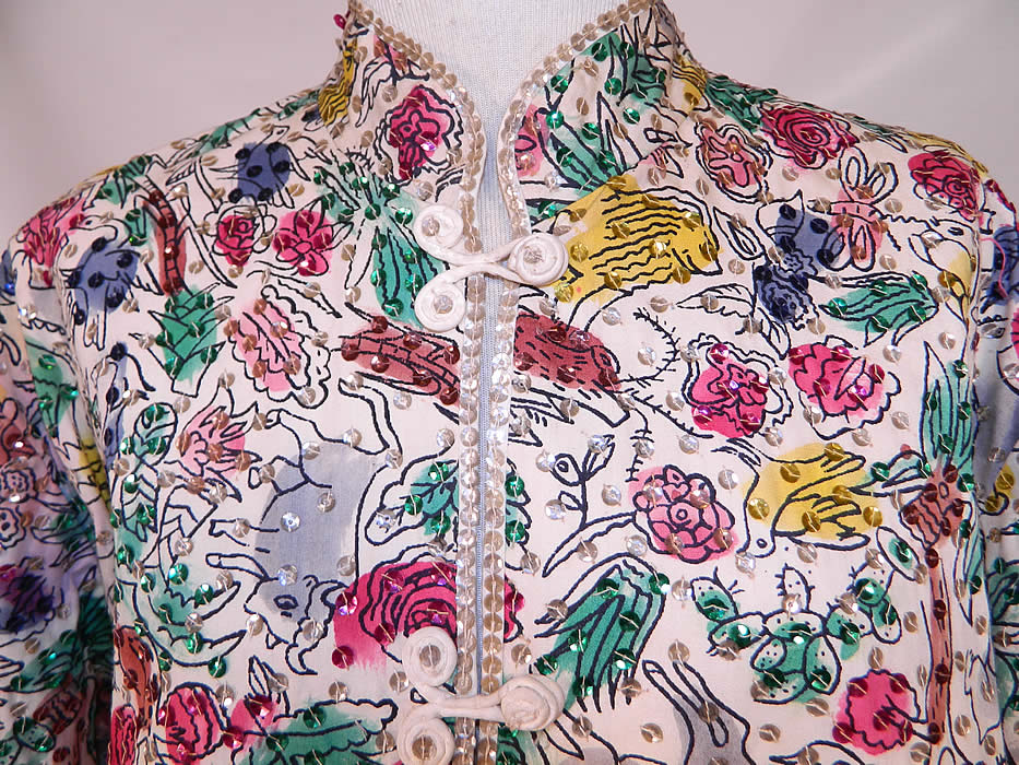 Vintage Teresa Original Taxco Mexican Figural Animals Hand Painted Sequin Jacket. There are a variety of animals, lions, bulls, deer, rabbits, dogs, goats, birds, donkey, insects, people and plants. There are hand sewn silver sequins trimming and covering the jacket.