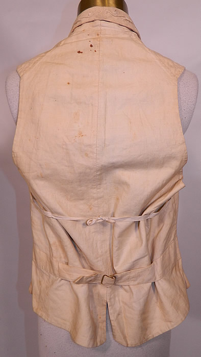 Victorian Gentleman's Cream Wool Embroidered Wedding Waistcoat Vest. There is a linen fabric backing, with a V bottom, an adjustable brass buckle strap and tie strap above on the back and is fully lined inside with a padded front, leather trim along the bottom.