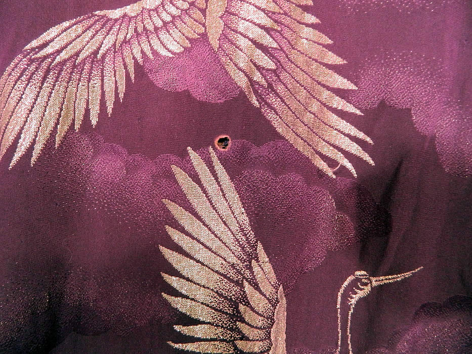 Vintage Japanese Geisha Purple Silk Silver Crane Mon Family Crest Formal Kimono. It is in good condition, with only a small cigarette hole burn on the bottom back skirt (see close-up). This is truly a wonderful piece of wearable Japanese textile art! 