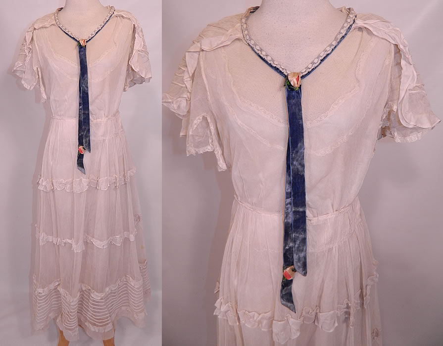 Vintage Crinoline Maid Edwardian White Net Lace Ruffle Shawl Collar Dress. This vintage Crinoline Maid Edwardian era white net lace ruffle shawl collar dress dates from 1918. It is made of a sheer fine white net, with pleating, ruffles and lace trim edging. 