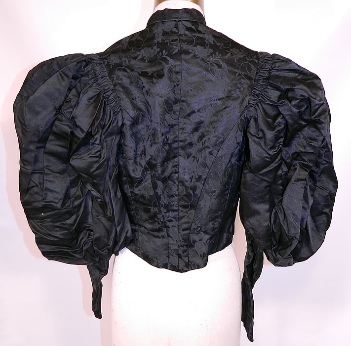 Victorian Black Silk Damask Brocade Gigot Mutton Sleeve Shirt Bodice. It is fully lined with quality construction detail, 12 stays boning sewn inside.