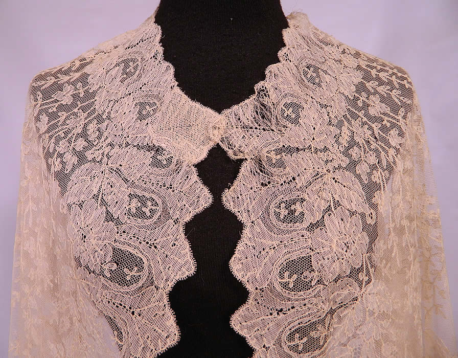 Victorian Civil War Antique Blonde Chantilly Lace Mantilla Shawl Cloak Cape. It has been created into a large cloak cape shaped shawl style wrap with a rounded neckline, front opening and no closure.