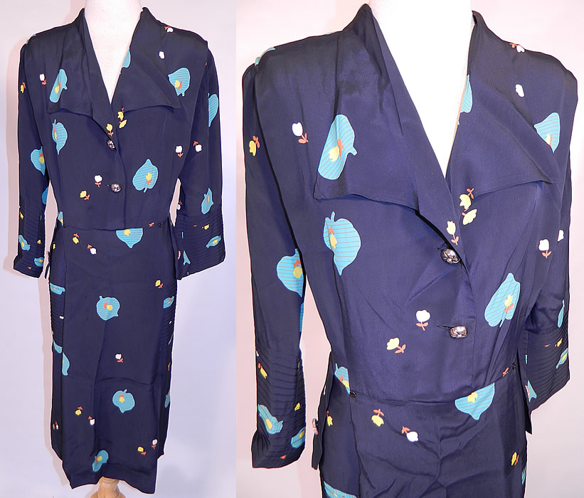 Vintage Navy Blue Rayon Heart Shape Leaf Tulip Flower Novelty Print Dress. This vintage navy blue rayon heart shape leaf tulip flower novelty print dress dates from the 1940s. It is made of a navy blue rayon fabric, with turquoise blue heart shape leaf and yellow, white tulip flower novelty print pattern.