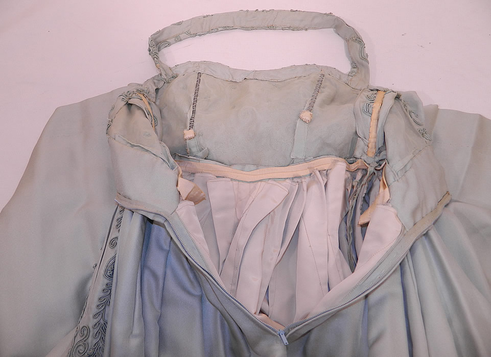 Vintage Blue Silk Crepe Soutache Passementerie Trim Circle Skirt Halter Dress. The dress measures 50 inches long, with a 24 inch waist and 34 inch bust. It is in good condition. This is truly a wonderful piece of quality custom made wearable art! 