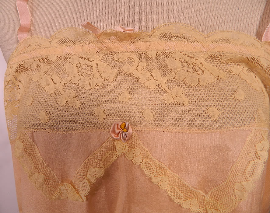Vintage Flapper Underwear Pink Silk Cream Lace Lingerie Chemise Teddy Slip. This lovely lingerie chemise teddy slip is loose fitting, has a drop waist, crotch panty panel, side slit shorts bottom, pink silk ribbon shoulder straps and an adjustable silk drawstring neckline. 