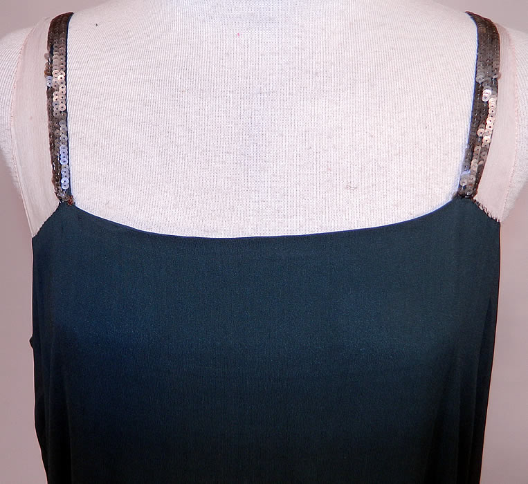 Vintage Green Silk Pink Sequin Beaded Floral Drop Waist Flapper Dress Slip
It is made of a dark forest green silk fabric, with a colorful pink, purple, green, gold and silver sequin beaded lush floral designs along the bottom skirt.