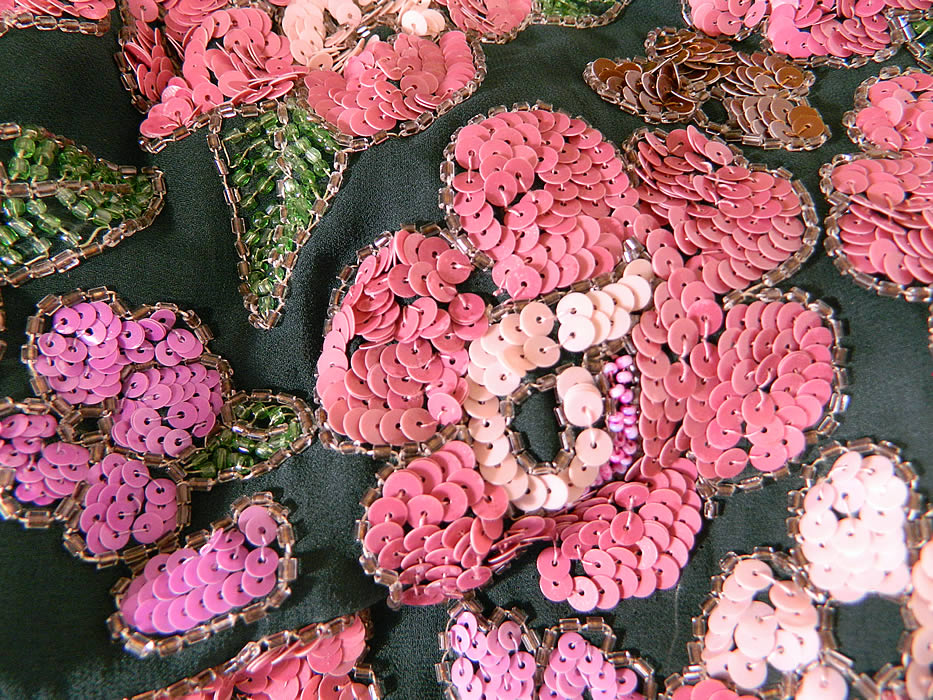 Vintage Green Silk Pink Sequin Beaded Floral Drop Waist Flapper Dress Slip
The dress measures 46 inches long, with 42 inch hips, a 36 inch waist and 36 inch bust. It is in good condition.