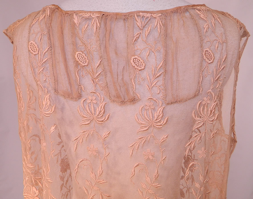 Vintage Ecru Embroidered Net Lace Silk Rosette Chemise Shift Slip Dress. 
The dress measures 44 inches long, with 38 inch hips, a 38 inch waist and 38 inch bust. 