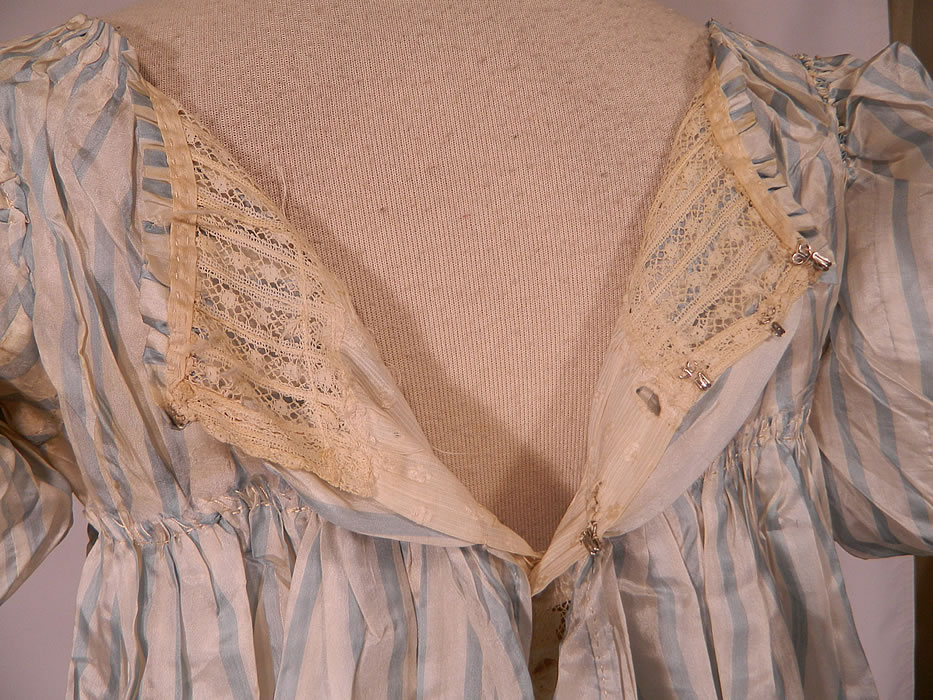 Antique Georgian Regency Era Blue & White Stripe Silk Puff Sleeve Girls Dress
It is in good condition, with only a few small faint stains on the dress sleeve and slight underarm discoloration. 