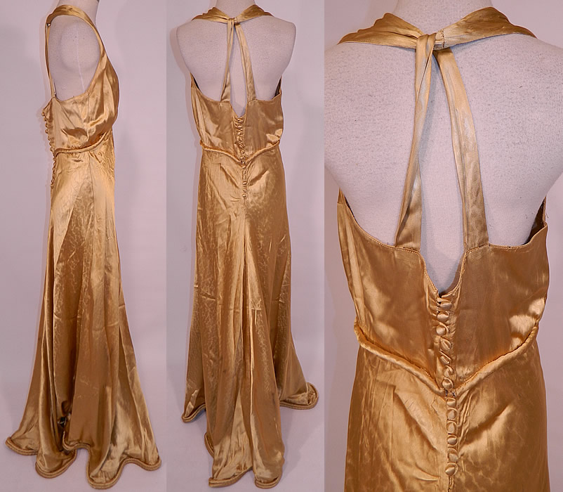 Vintage Hollywood Glam Gold Silk Satin Sexy Bias Cut Dress Evening Gown
This gorgeous gown has a sexy fitted bias cut style, with a long full floor length skirt, rolled padded hemline, halter top, sleeveless, backless, with a twisted loop strap back, plunging V front neckline, silk covered buttons on the back for closure and unlined. The dress measures 67 inches long, with 42 inch hips, a 30 inch waist and 38 inch bust.