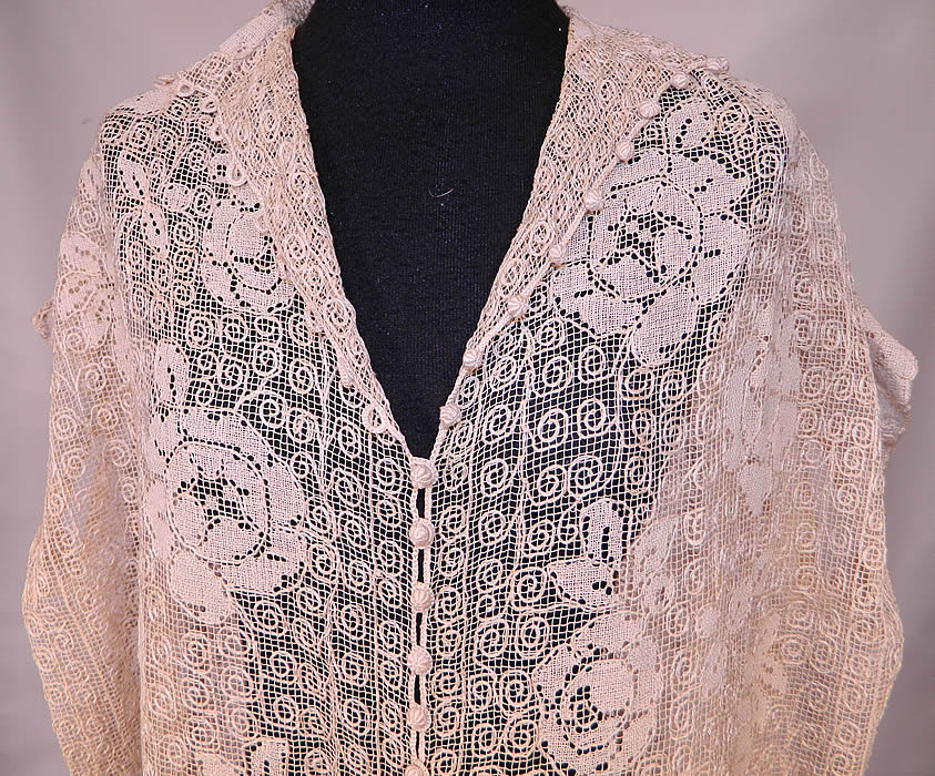 Vintage Ecru Cream Crochet Filet Lace Button Trim Drop Waist Dress
This lovely lace boho dress is loose fitting, a drop waist style, with short cap sleeves, a fold over collar, V neckline, tiny round crochet buttons down the front for closure and is sheer, completely unlined.