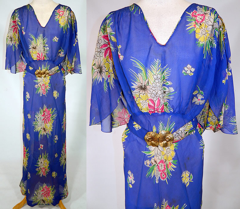 Vintage Blue Silk Chiffon Floral Bouquet Print Belted Bias Cut Dress.
This vintage blue silk chiffon floral bouquet print belted bias cut dress dates from the 1930s. It is made of a bright royal blue color sheer silk chiffon fabric, with a colorful floral bouquet print pattern design.