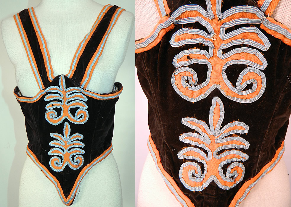 Victorian Black Velvet Applique Soutache Trim Swiss Waist Corset Vest Bodice . 
This antique Victorian era black velvet applique soutache trim Swiss waist corset vest bodice dates from the 1860s. It is hand stitched, made of a black silk velvet fabric, with a coral orange color wool and baby blue silk soutache trim edging and decorative applique work.