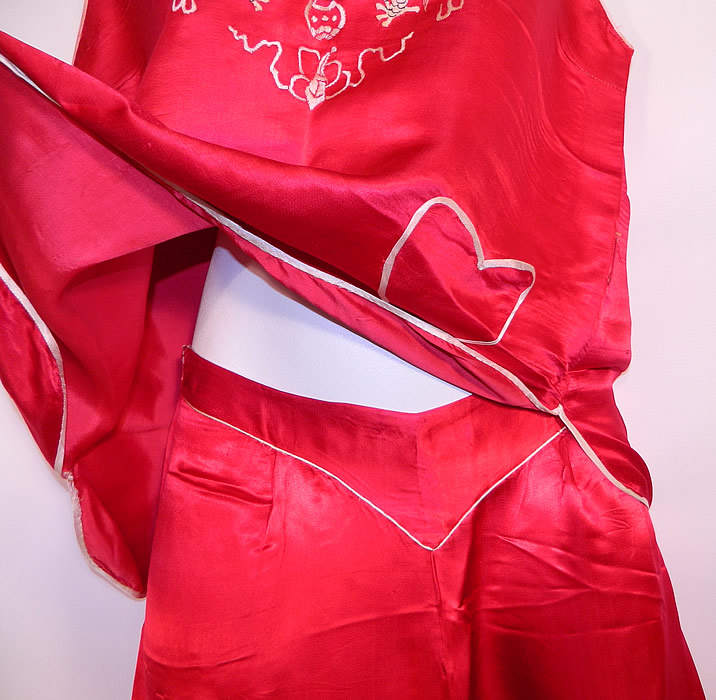 Vintage Red & White Silk Embroidered Asian Chinese Dragon Pajamas. 
Included in this two piece lingerie lounging pajamas is a sleeveless tank top shirt blouse, with a pullover style, V front neckline and heart shaped patch pocket sewn onto the bottom front. 