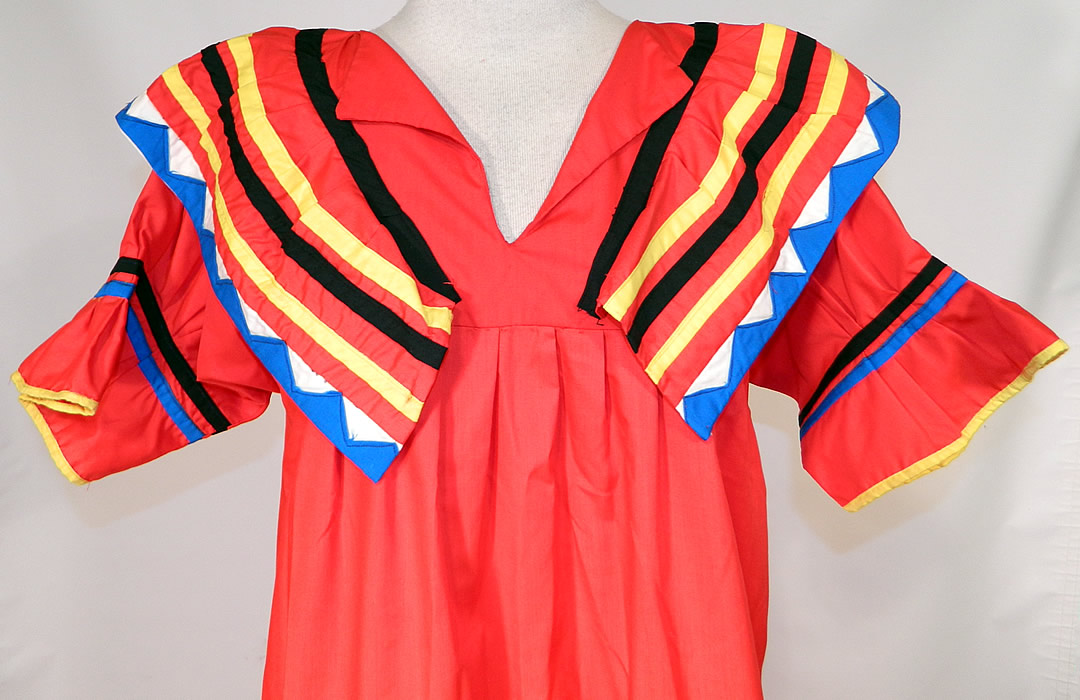 Vintage Seminole Native American Indian Sawtooth Patchwork Colorful Boho Maxi Dress
This beautiful boho tribal maxi dress is a long floor length, with a loose fitting style, shawl collar and short sleeves with ruffle cuffs.