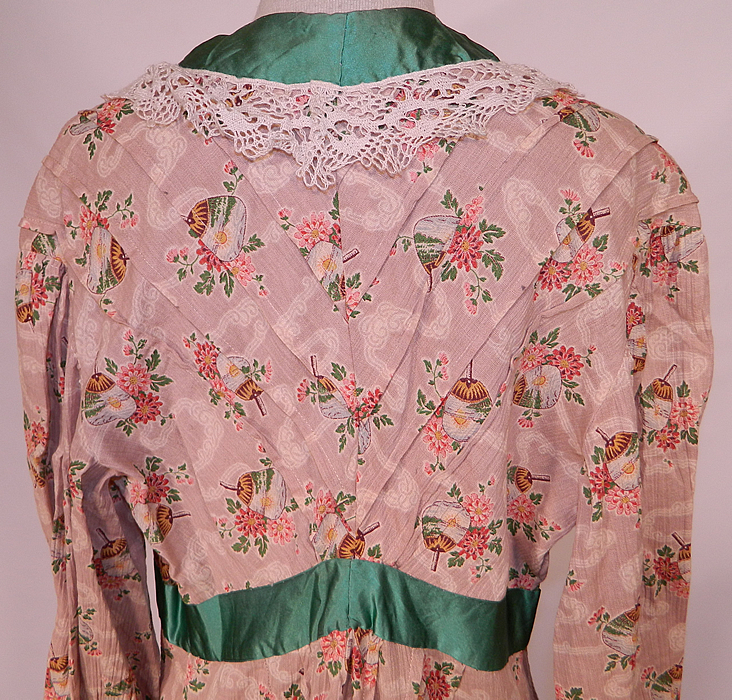 Edwardian Art Nouveau Japanese Floral Fan Print Dressing Gown Robe & Bed Cap Bonnet
The robe measures 53 inches long, with 46 inch hips, a 30 inch waist, 38 inch bust, 16 inch back and 18 inch long sleeves. Included is a matching fabric bed bonnet cap, with lace trim along the bottom and a green ribbon bow on the front.
