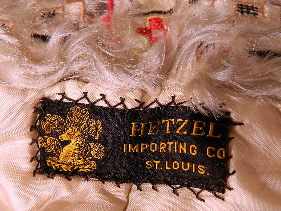 Edwardian Hetzel Importing Co Gray Wool White Mohair Lace Trim Winter Traveling Coat
This wonderful winter high fashion traveling coat has a loose fitting, long floor length style, with a mohair wide lapel shawl collar, which can be folded up creating a high neck collar with 3 gold brass turquoise studded button closures, gathered smocking tucks around the shoulders, cuffs, long full billowing sleeves, a fitted back, hook closure on the front and is fully lined, with an inside pocket and "Hetzel Importing Co St. Louis" label sewn inside.