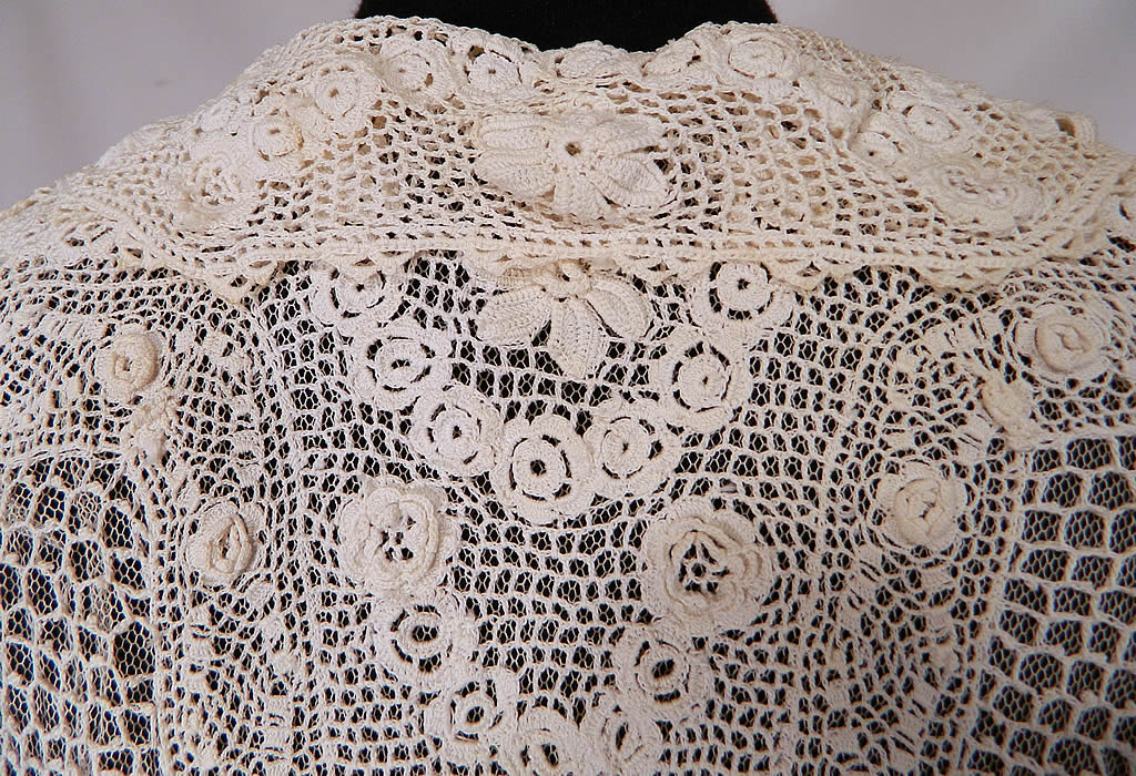 Edwardian White Irish Crochet Lace Middy Shirt Blouse
The blouse measures 17 inches long, with a 28 inch waist, 34 inch bust, 14 inch back and 15 inch long sleeves. It is in good condition, but has not been cleaned with some faint discoloration on the front neckline. This is truly an exquisite piece of antique textile lace wearable art! 