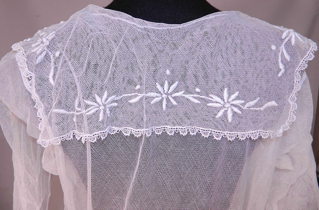 Vintage Edwardian Sheer White Net Floral Embroidered Lace Middy Dress
The dress measures 48 inches long, with 34 inch hips, a 24 inch waist, 34 inch bust and 13 inch back. It is in good condition, with only a tiny pin hole on the front top shoulder area (see close-up). This is a wonderful piece of antique textile art which could be worn as a wedding gown, graduation dress or for a garden party tea! 