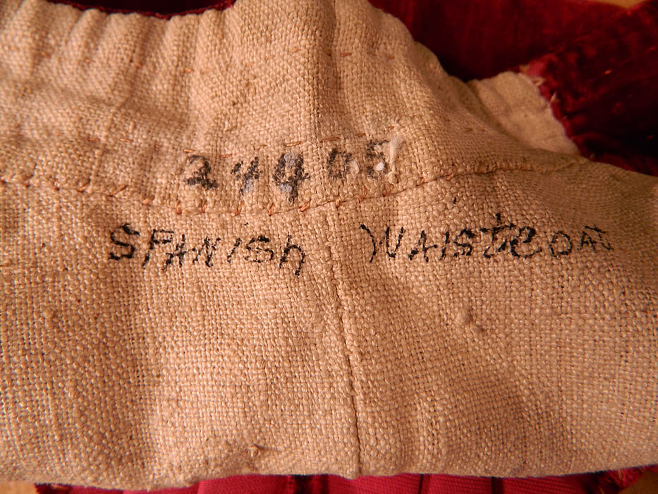 Vintage Regional Folk Costume Spanish Soutache Embroidery Red Velvet Vest
The vest is in good condition and is a museum deaccession with "Spanish Waistcoat" written inside in ink (see close-up). This is truly a wonderful rare piece of wearable Spanish textile folk art! 