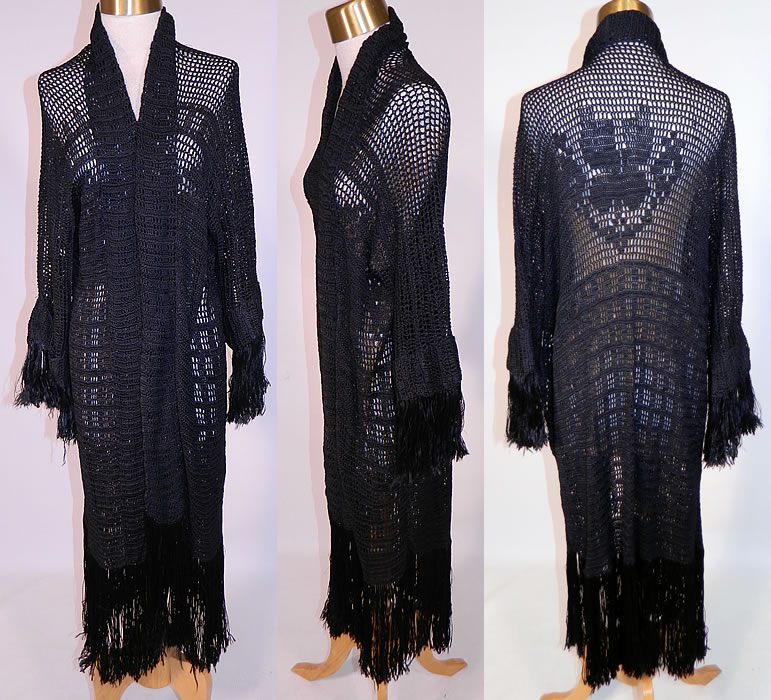 Vintage Black Silk Knit Crochet Lace Fringe Shawl Long Coat Boho Sweater Jacket
This vintage Art Deco black silk knit crochet lace fringe shawl long coat boho sweater jacket dates from the 1920s. It is made of a black silk knit crochet lace with detailed meshwork, a striped grid, floral designs and hand knotted fringe trim.