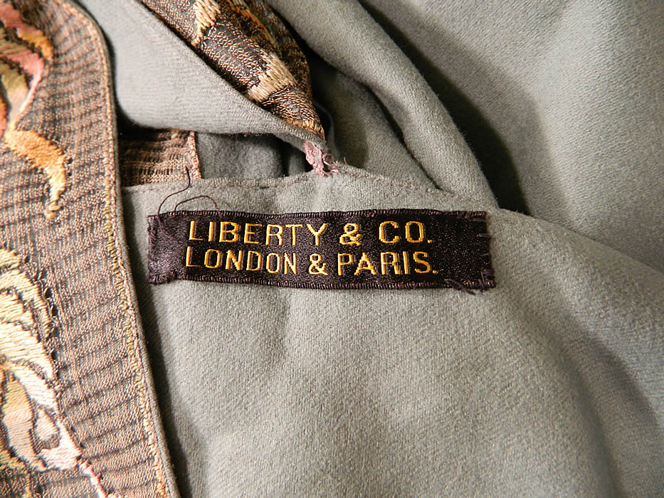 Vintage Liberty & Co. London Paris Label Teal Blue Wool Embroidered Cloak Cape
There is a "Liberty & Co. London & Paris." label sewn inside the front neckline. 