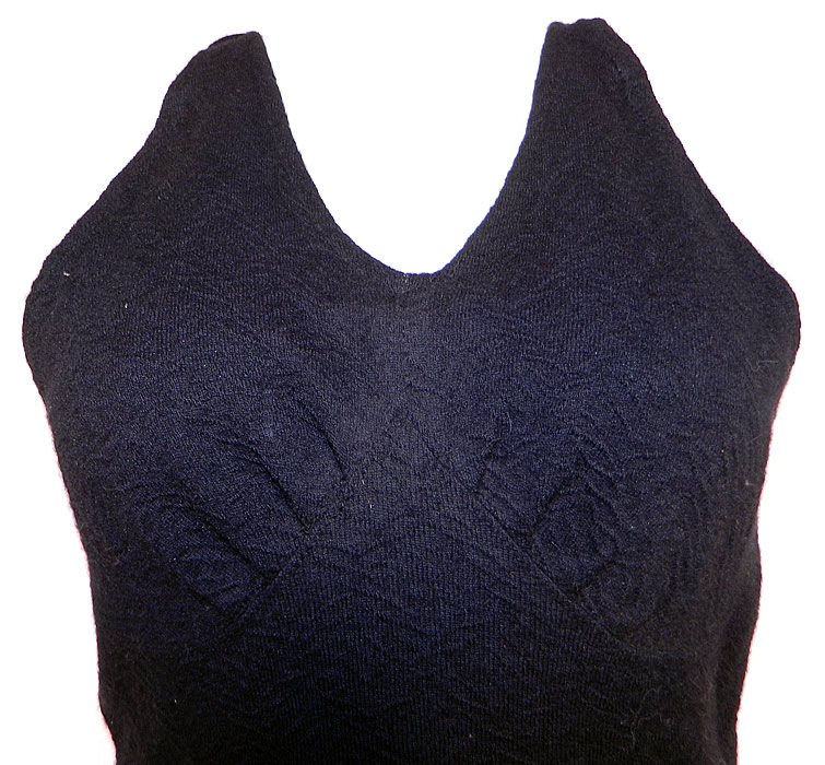 Vintage Jantzen Women's Black Wool Knit Onepiece Swimsuit Size 38
This women's one piece style swimsuit has a bias cut top, with V front neckline, shoulder straps, an adjustable tie back neck, backless, with a skirted bottom and attached shorts underneath.