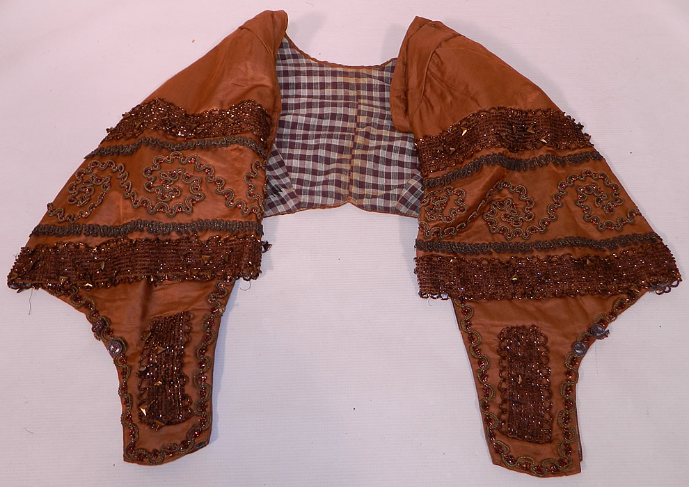 Victorian Civil War Brown Silk Bronze Beaded Bodice Bolero Cropped Spencer Jacket
It is in good condition, with only a small fray on one shoulder seam and sleeve. This is truly a wonderful piece of antique Victoriana wearable beaded art! 