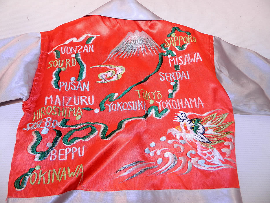 Vintage WWII Japan Souvenir Tour Jacket Child's Shirt Satin Embroidered Map
The jacket measures 12 inches long, with a 21 inch waist, 22 inch chest, 11 inch back shoulders and 11 1/2 inch long sleeves. 