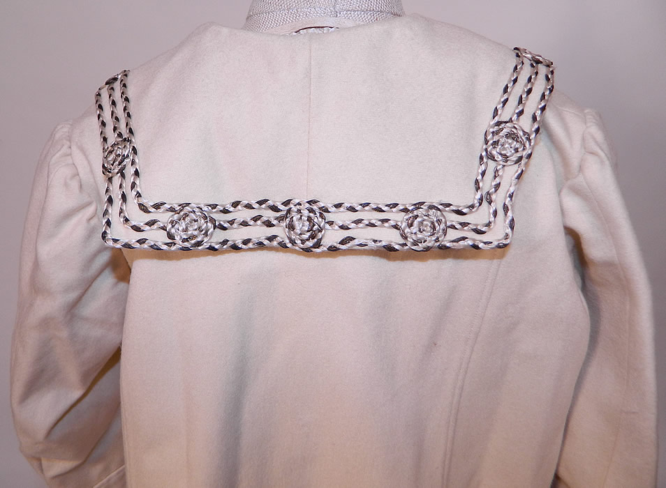 Edwardian White Wool Silver Soutache Braided Trim Childs Winter Coat
The coat measures 20 inches long, with a 36 inch waist, 30 inch chest and a 11 inch back. It is in excellent clean condition. This is truly an exceptional piece of wearable antique textile art! 