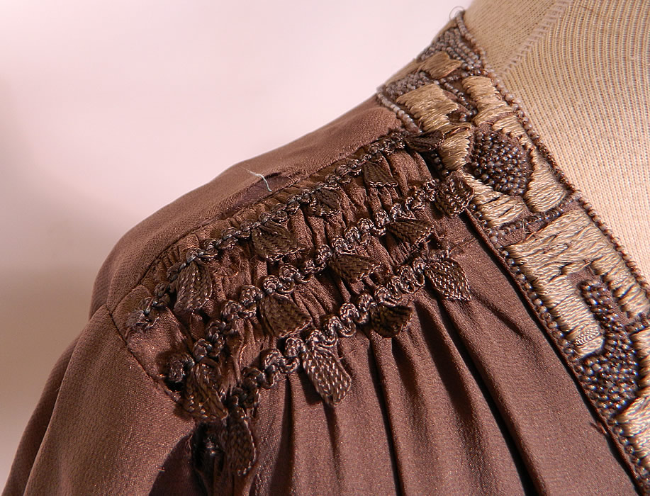 Vintage Art Deco Gray Silk Embroidered Silver Beaded Flapper Drop Waist Dress
It is in good condition, with only a tiny fray in the silk fabric on the front top, back bottom skirt and shoulder (see close-up). 