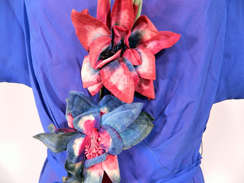 Vintage Blue Fuchsia Silk Chiffon Grecian Goddess Gown Belted Bias Cut Dress
This gorgeous Grecian goddess gown has a bias cut, a long flowing floor length layered skirt with slight back train, short cap sleeves, a high cowl drape neckline, a key hole opening back, side snap closures, a matching fabric belted tie sash and has a fuchsia silk slip lining inside.