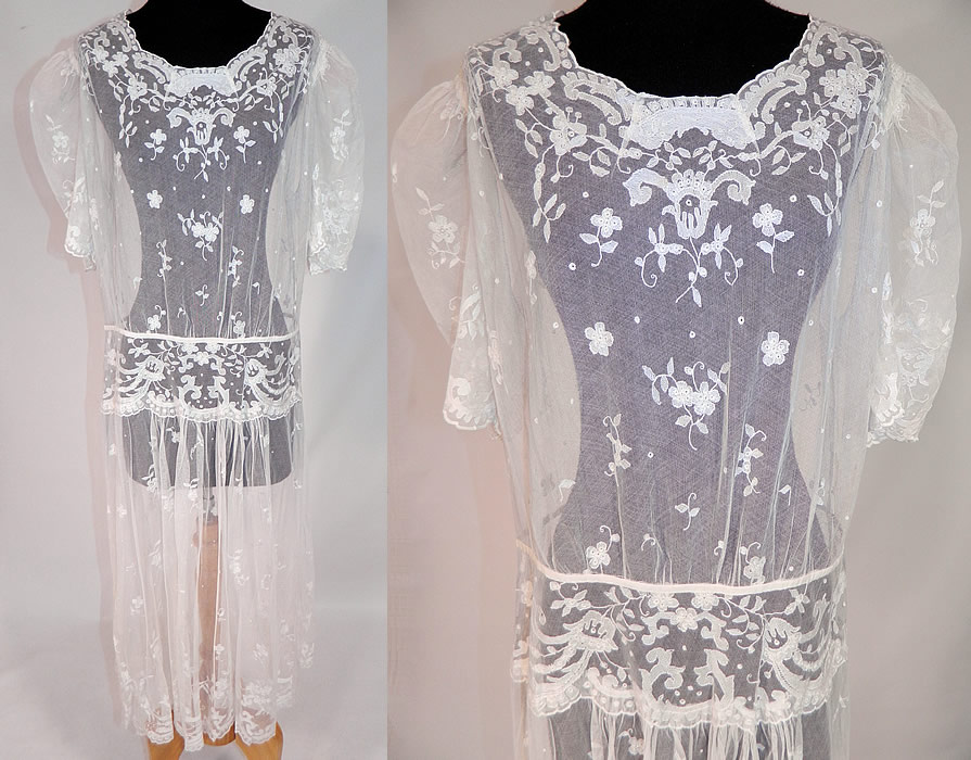 Vintage White Tambour Embroidery Lace Sheer Silk Tulle Net Drop Waist Dress
This vintage white tambour embroidery lace sheer silk tulle net drop waist dress dates from the 1920s. It is made of a white sheer silk tulle net lace fabric with fine tambour stitch embroidery work done in a floral vine leaf, polka dot pattern design.