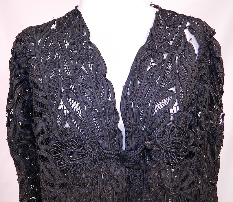 side Edwardian La Samaritaine Brussels Black Silk Battenburg Tape Lace Long Coat Jacket
This lovely lace loose fitting coat jacket is a long length, with long full sleeves, fitted cuffs, large decorative silk soutache toggle button closures on the front and back and is sheer, unlined.