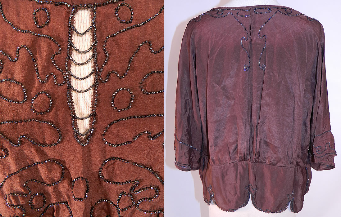 Vintage Art Deco Brown Silk Silver Beaded Flapper Blouse Shirt Top
This beautiful beaded blouse has a long loose fitting style, with a scalloped beaded trim edging skirted bottom hem, peek-a-boo keyhole beaded strand front opening, 3/4 length long full sleeves and snap closures on the back neck. The top measures 20 inches long, with a 34 inch waist and 46 inch bust. It is in good condition. This is truly a wonderful piece of wearable Art Deco textile art!
