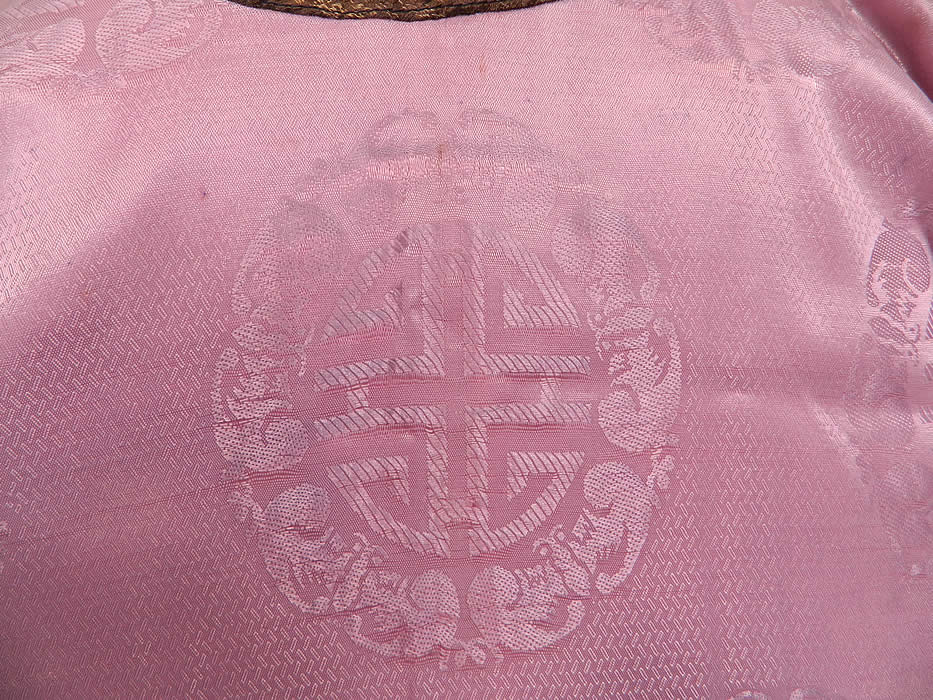 Antique Chinese Character Embroidered Purple Lilac Silk Damask Brocade Robe
The robe measures 30 inches long, with a 44 inch waist and 44 inch chest. It is in good as-is condition, with some fade discoloration in areas. This is truly a wonderful piece of wearable antique Chinese art!