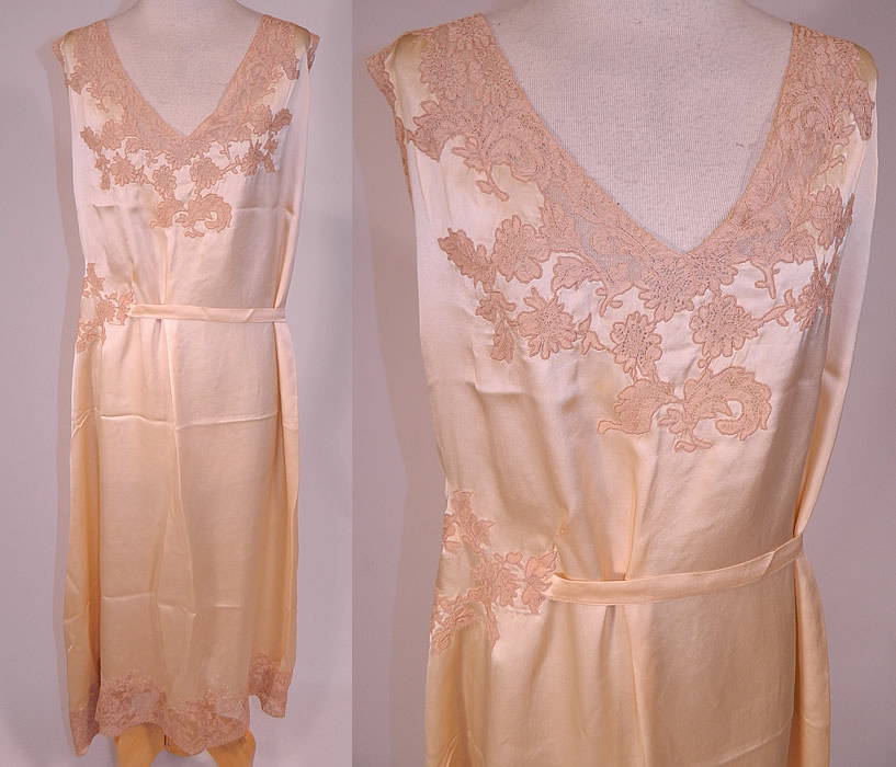 Vintage Cream Silk Ecru Lace Boudoir Belted Bias Cut Negligee Nightgown
This vintage cream silk ecru lace boudoir belted bias cut negligee nightgown dates from the 1930s. It is hand stitched, made of an off white cream color silk fabric, with ecru lace trim edging and appliqu&eacute; inserts. This beautiful boudoir peignoir negligee nightgown slip dress has a bias cut, attached belted tie sash on the side, is a long full length with lace trim bottom hemline, sleeveless and has V necklines.