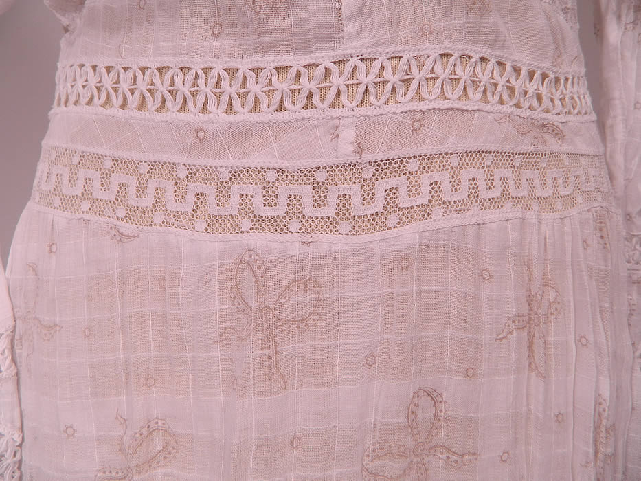 Edwardian White Window Pane Cotton Batiste Bow Polka Dot Print Fabric Lace Trim Dress
This beautiful bow lace trim dress is a long floor length, with a high neck lace collar, lace trim yoke top, long sleeves with flared lace cuffs, a fitted waist, mother of pearl buttons, hook closures down the back and is sheer, unlined.