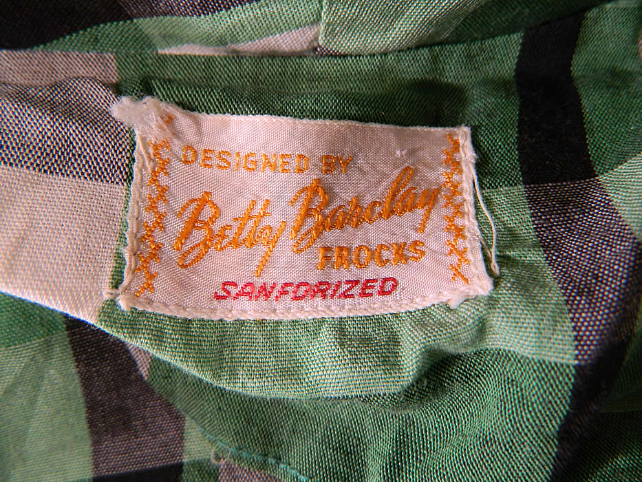 Vintage Betty Barclay Frocks Green Gingham Check Cotton Circle Skirt Dress & Jacket
There is a "Designed By Betty Barclay Frocks Sanforized" label sewn inside. The dress measures 43 inches long, with 34 inch hips, a 24 inch waist and 34 inch bust. 