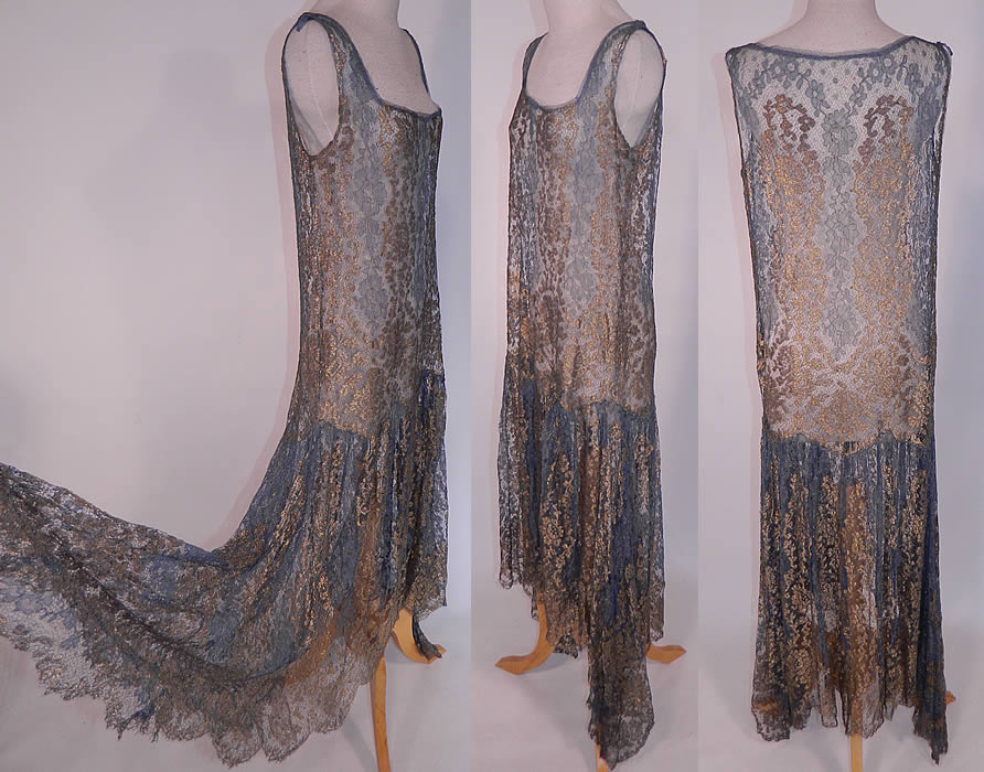 Art Deco Blue Net Gold Lamé Lame Lace Handkerchief Skirt Drop Waist Flapper Dress
This fabulous flapper style drop waist dress is sleeveless, with a squared scoop front neckline, an uneven asymmetrical handkerchief hemline full skirt, longer along the sides, with a scalloped bottom hem and is sheer, unlined. 