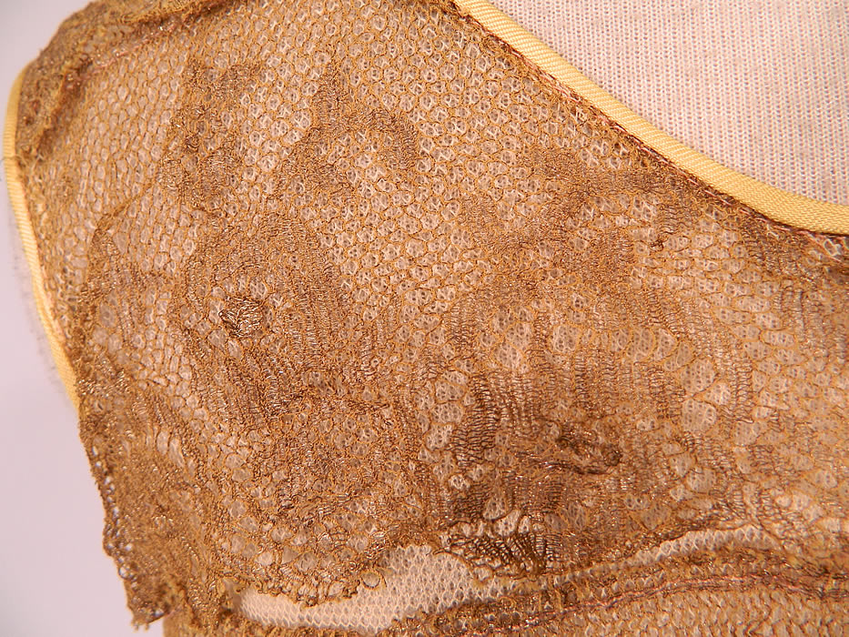 Vintage Gold Metallic Lam&eacute; Lame Lace Layered Tiered Ruffle Tango Flapper Dress 
The dress measures 48 inches long, with 34 inch hips, a 24 inch waist and 34 inch bust. It is in excellent condition. This is truly a wonderful piece of Art Deco wearable textile art! 