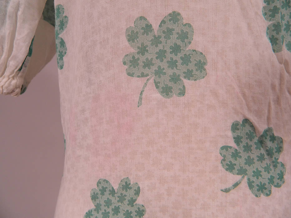Vintage Green Shamrock Clover Print White Cotton Bias Cut St. Patricks Day Dress
The dress measures 46 inches long, with 34 inch hips, a 30 inch waist and 34 inch bust. It is in good condition, with only a small faint pinkish stain on the front side waist (see close-up). This is truly a rare and wonderful piece of wearable St. Patrick's Day art!