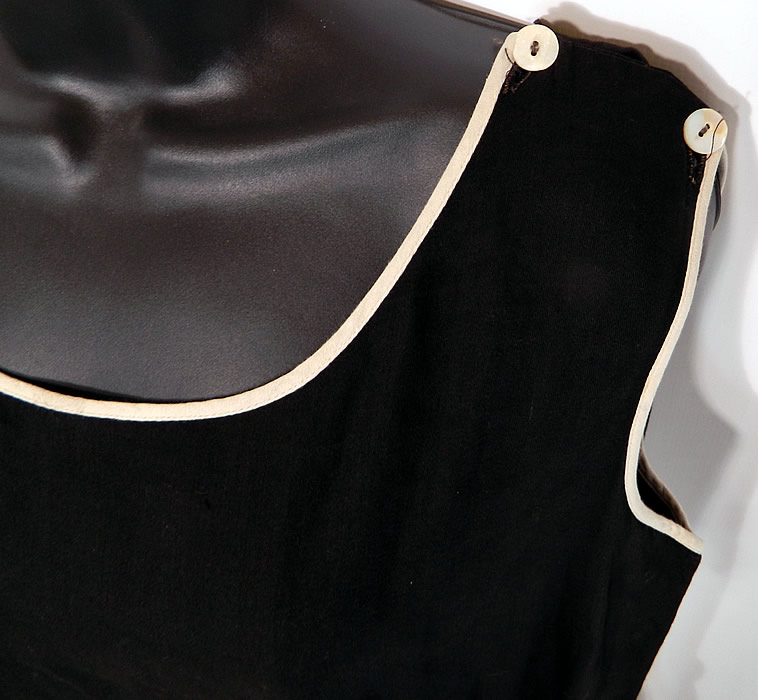 Vintage Black & White Cotton Belted Bathing Suit Swimsuit Dress & Bloomers
The swimsuit measures 37 inches long, with 48 inch hips, a 42 inch waist and 42 inch bust. It is in good condition, with only some minor wear and a small faint stain on the white trim belt. This antique authentic "bathing beauty" costume is truly a rare and wonderful piece of wearable art!
