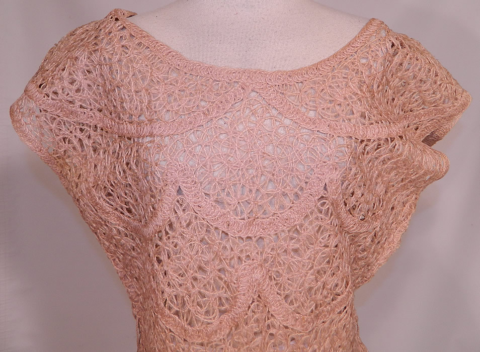 Vintage Blush Pink Sheer Scalloped Ribbonwork Hand Knit Crochet Circle Skirt Dress
This pretty pink dress has a rounded neckline, short cap sleeves, a full circle skirt with scalloped hemline, a side zipper closure and is sheer, unlined.