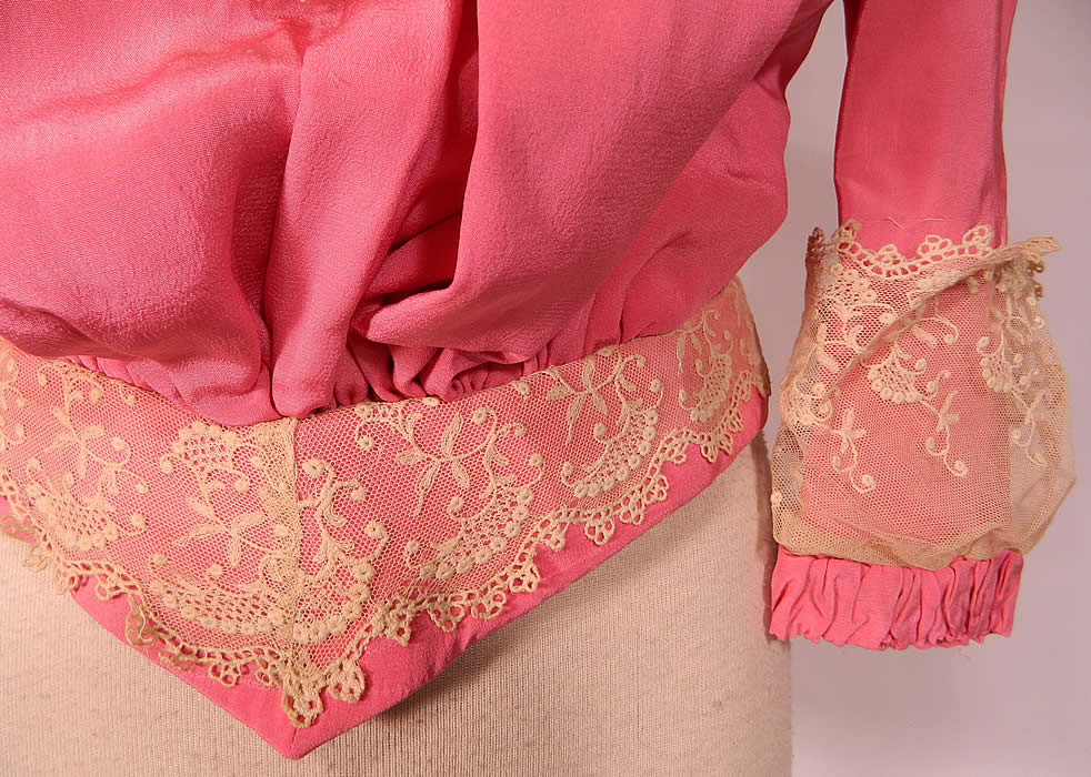 Victorian French Rose Pink Silk Wool White Lace Ruffle Trim Bodice Shirt
This beautiful bodice shirt top, has a high neck band collar, long full sleeves with gathering, lace trim cuffs, a fitted V waistband, slight pouter pigeon front, back hook closures and is fully lined inside.